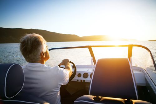 man driving speedboat