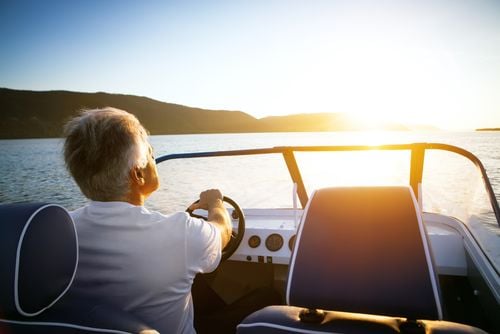man driving speedboat
